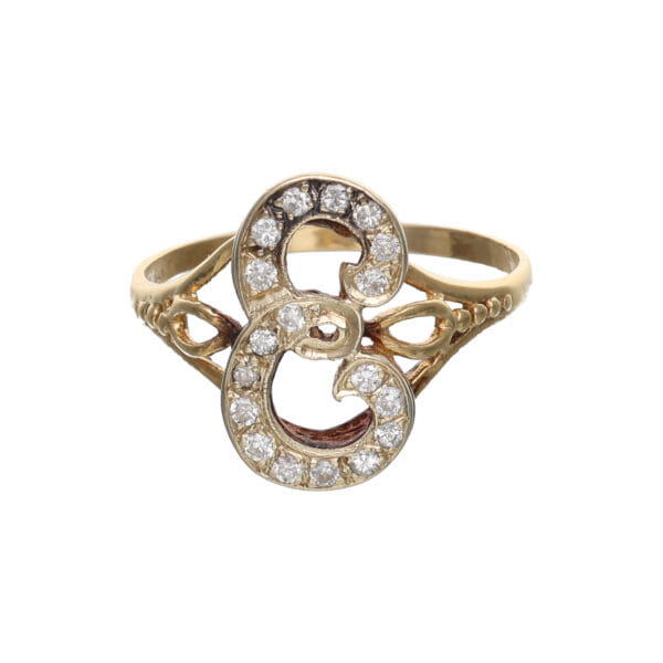 Anello anni 80 a forma di 'e' in oro con diamanti_1